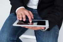 Image of man using tablet.